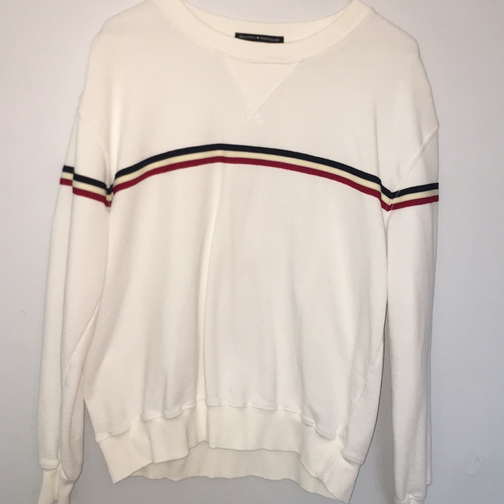 White sweatshirt with red, white, and blue stripes